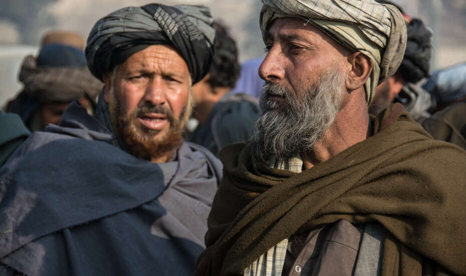 Janaan (right), age 40, fled to Kabul with his family. They live in an informal slum and benefit from Welthungerhilfe efforts.)
