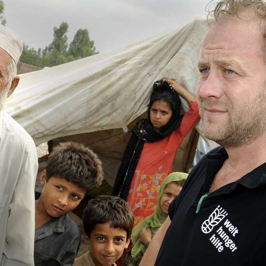 Refugees build their tents close to the highway between Peshawar and Mardan, Pakistan