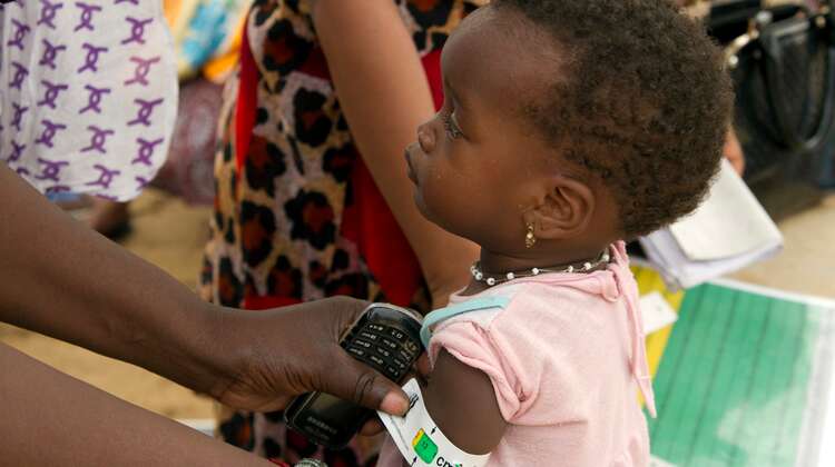 Measuring of an infant's arm.