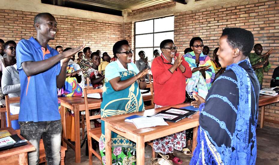Young people in Burundi applaud after a presentation on the Skill Up! training program.