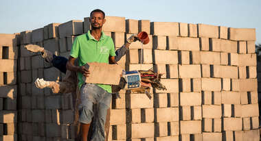 tand one behind the other and stretch out their arms, in each hand they hold a raw material for the production of bricks from waste materials.