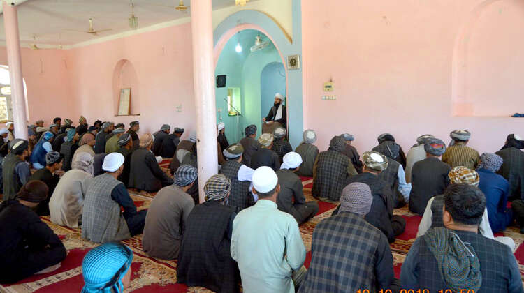 Religious leader speaks to men at mosque in Afghanistan Religious leader speaks to men at mosque in Afghanistan