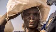 A woman at the refugee camp in Bentiu receives groceries.