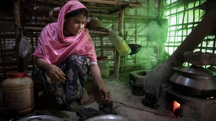 Rohingya woman Mostafa B. is cooking a meal in camp Hakimpara, Bangladesh. 