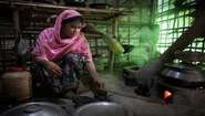 Rohingya woman Mostafa B. is cooking a meal in camp Hakimpara, Bangladesh. 