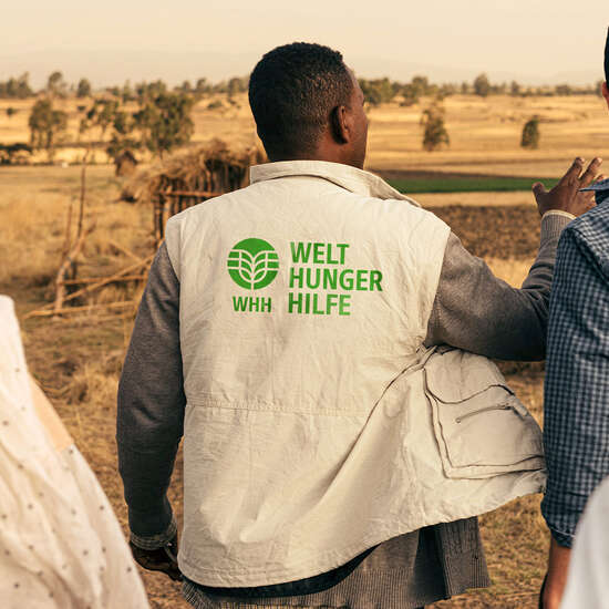 WHH staff member with branded jacket