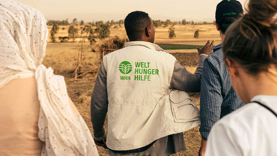WHH staff member with branded jacket