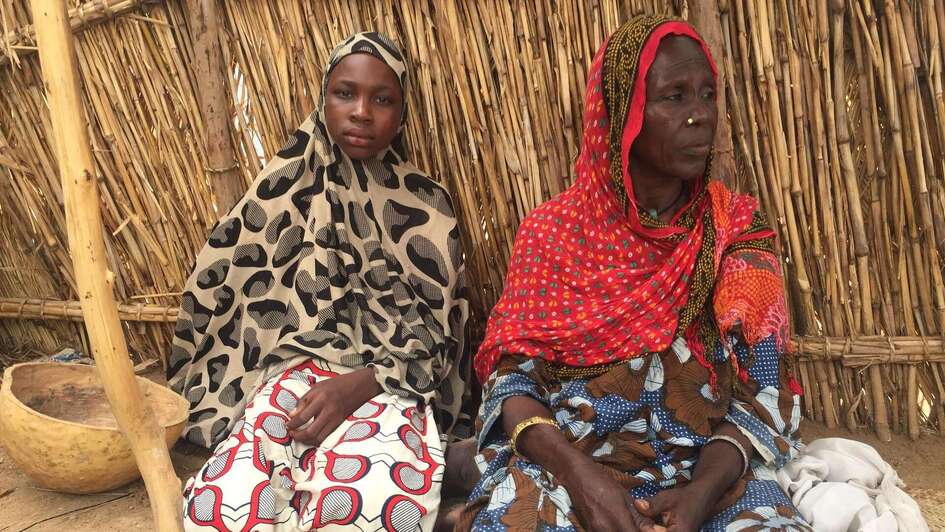 Two woman in a tent.