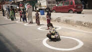 People in line for food in Delhi, India
