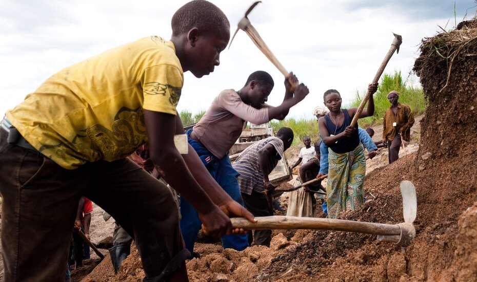 Workers repairing a road.