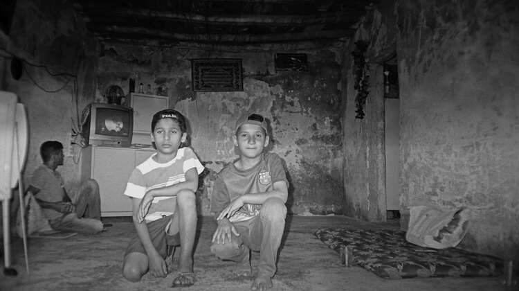 Juan takes pictures of his brother and a friend