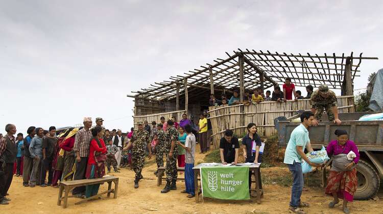People are waiting for food distribution