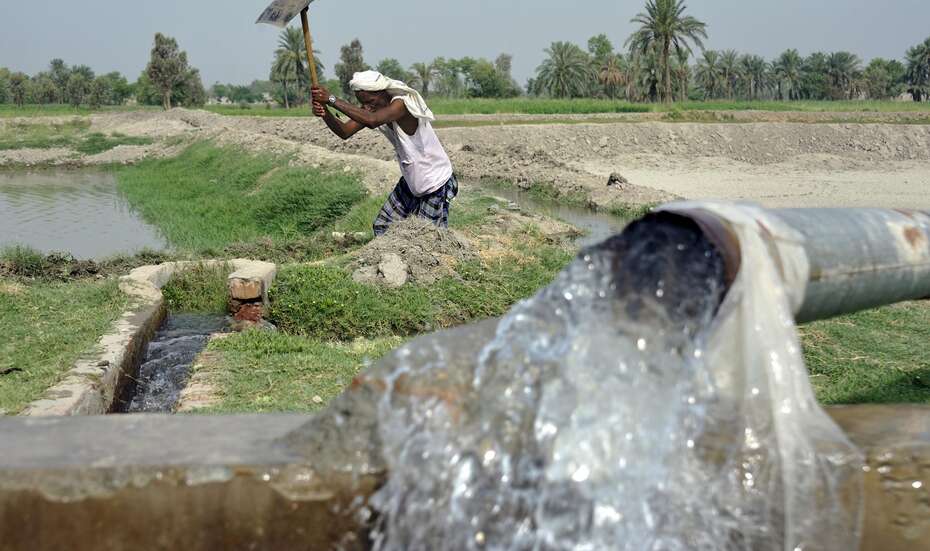 Man is cleaning the irrigation system