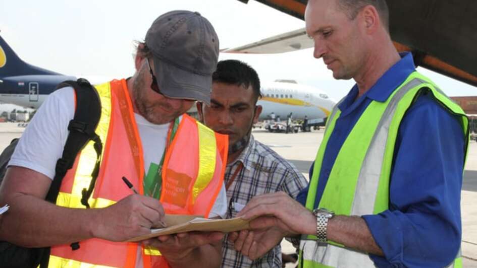 Emergency-worker Jürgen Mika signing some papers