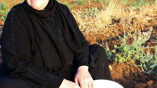 Sawsan Nahas from Hama, Syria, in a cucumber field