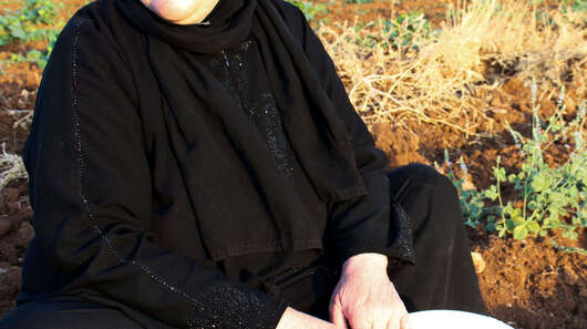 Sawsan Nahas from Hama, Syria, in a cucumber field in Mardin, Turkey.