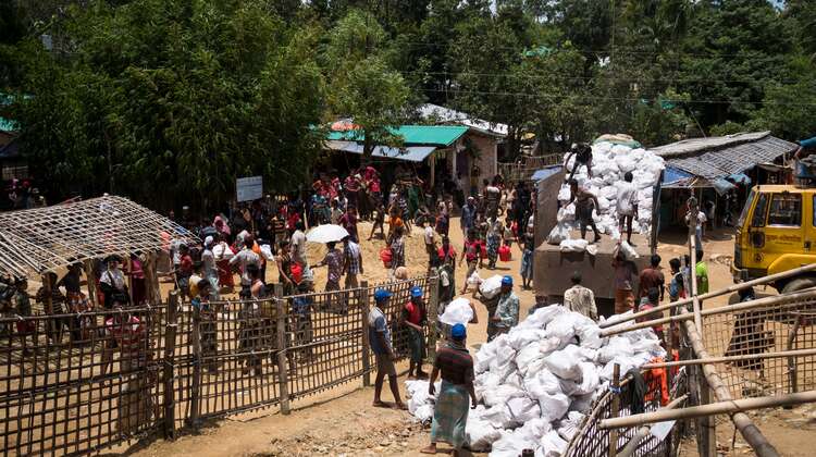Hakimpara refugee camp in Bangladesh: Local NGO FIVDB distributes sacks with charcoal and rice husk pellets to Rohingya refugees (August 2018).