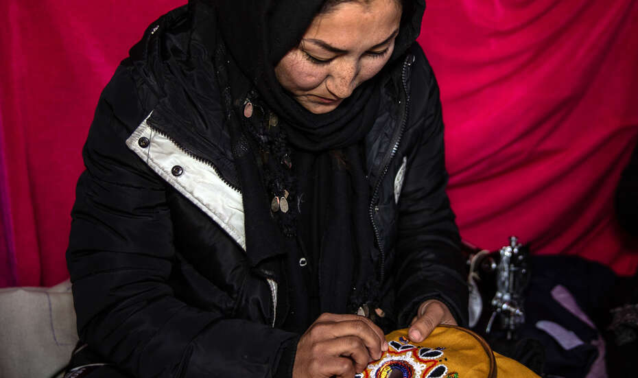 Shahnoz doing embroidery