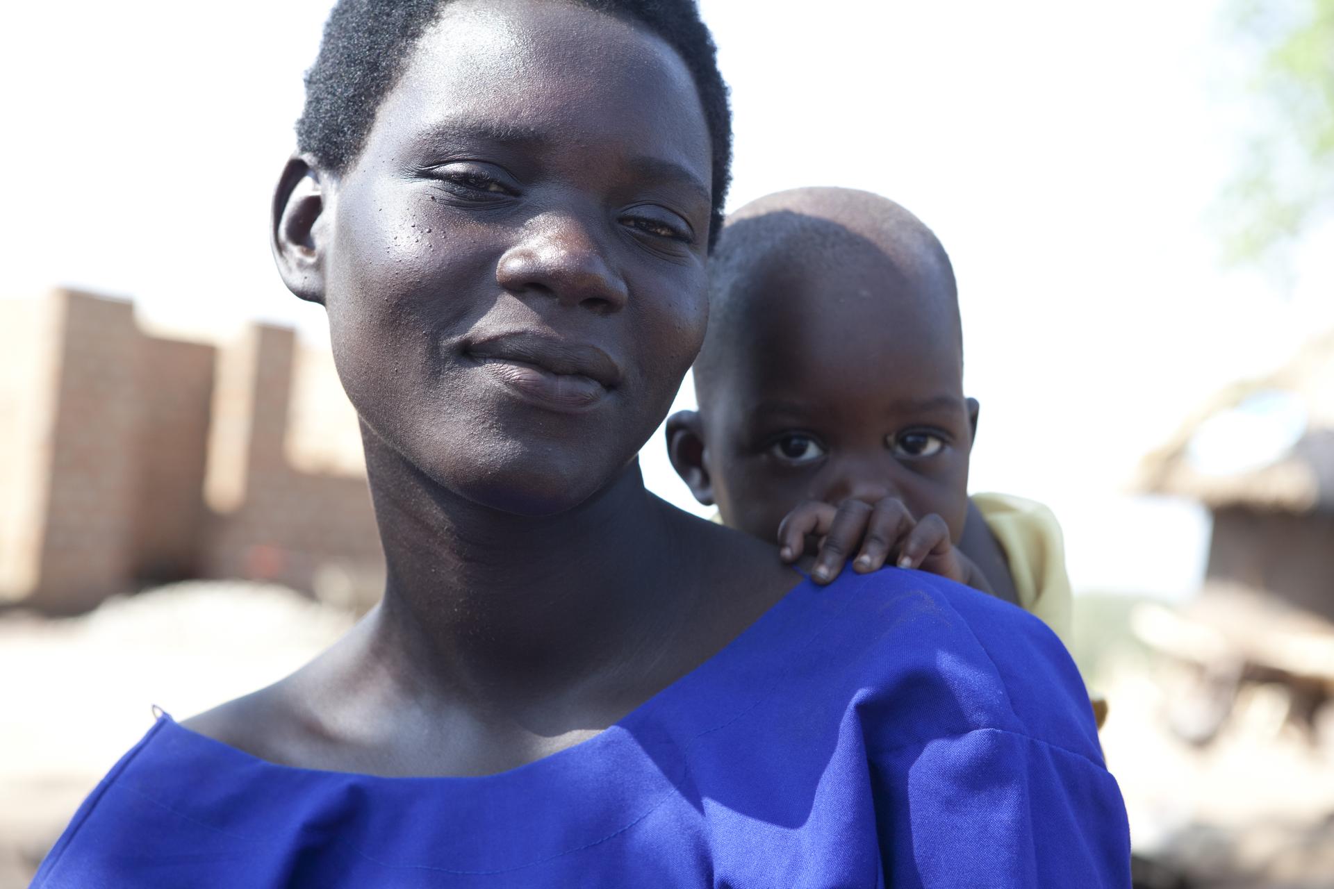 A woman who returns to her destroyed village in Uganda after years of flight.