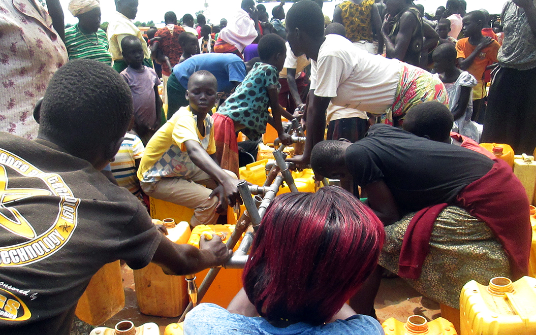 Refugees at a water point in the Bidibidi camp